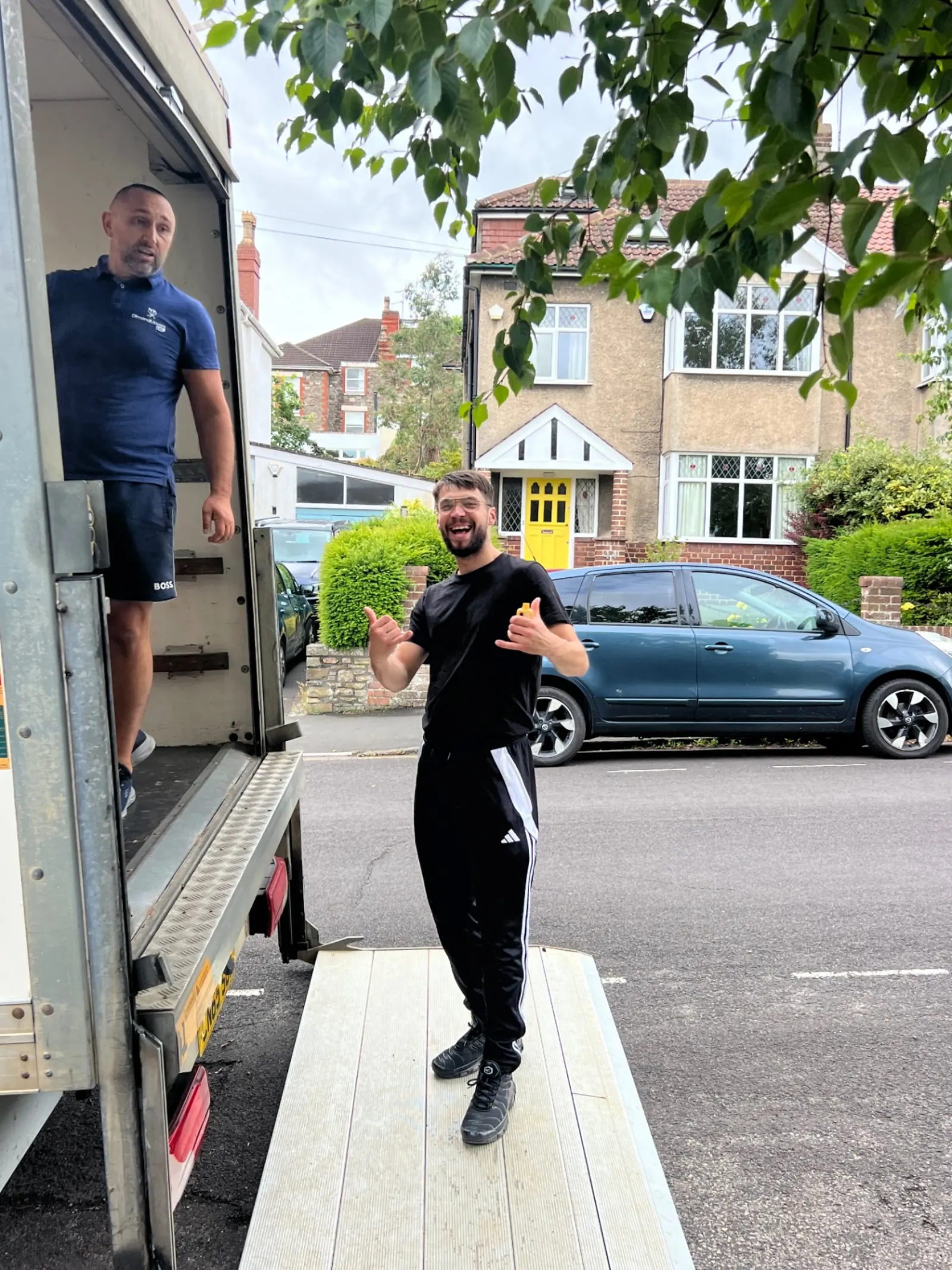 Dimond Movers crew loading a wrapped sofa into a branded van premium house removals Oxfordshire