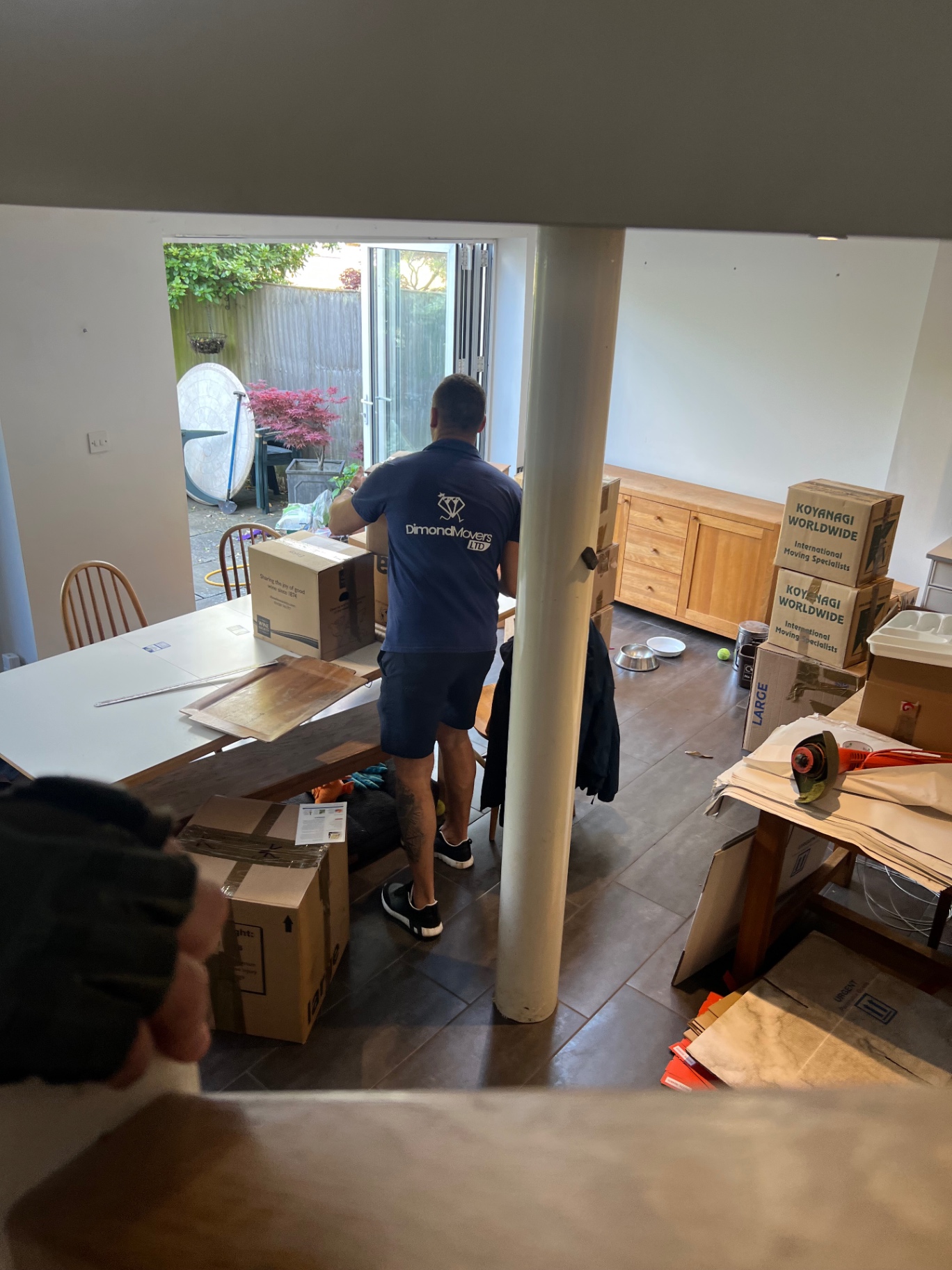 Real move completed by Dimond Movers in Bristol crew member by the van loading ramp