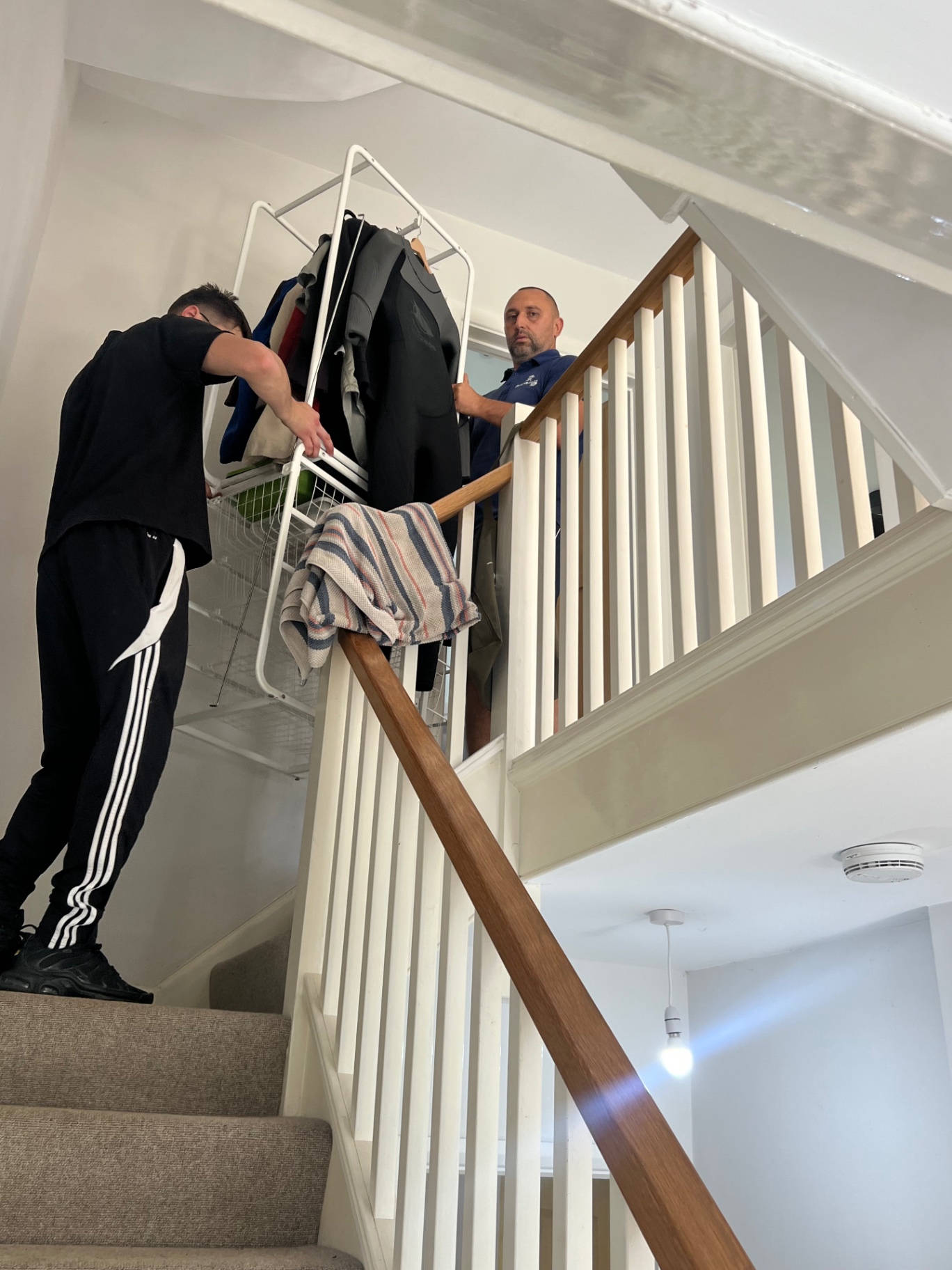 Professional loading during a Bristol house move Dimond Movers branded crew packing the Luton van