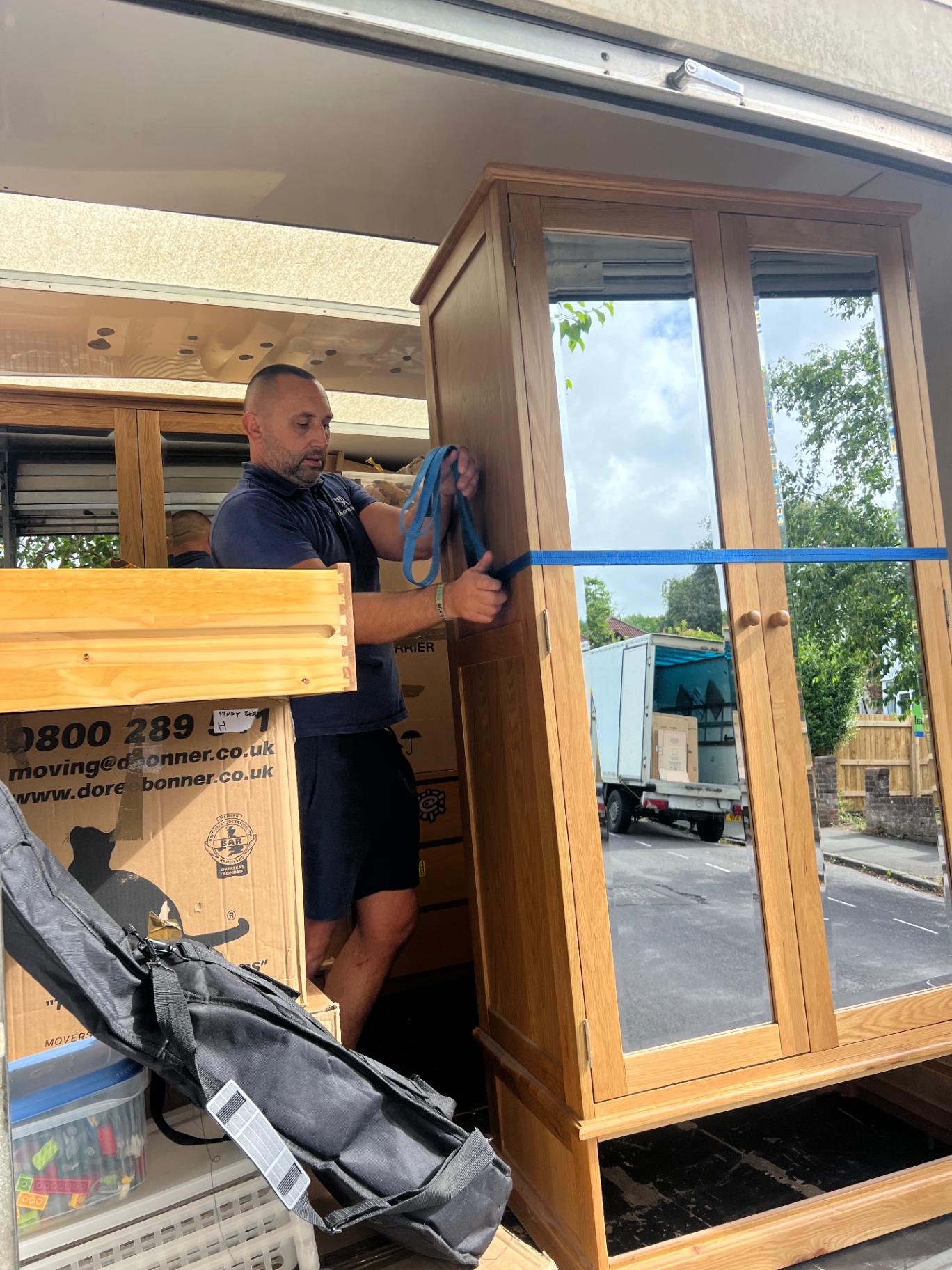 Dimond Movers team during a Bristol relocation preparing a customer wardrobe for transport