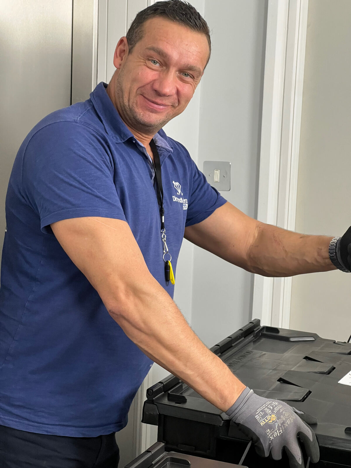 Dimond Movers team member packing crates during a professional office relocation